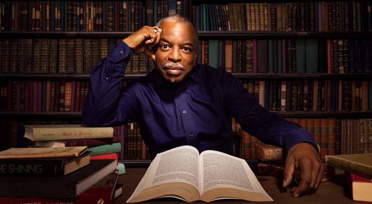 LeVar Burton in a library with an open book