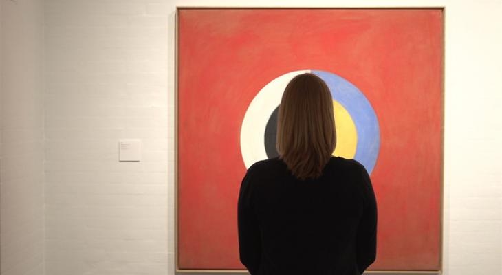 Person looking at a painting