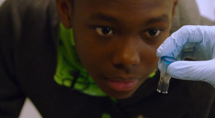 Person looking at a vial