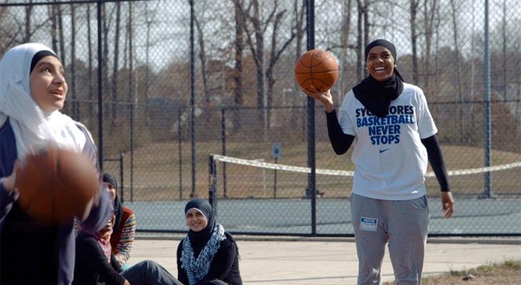 Teens playing basketball