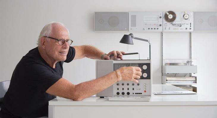 Dieter Rams siting at a desk