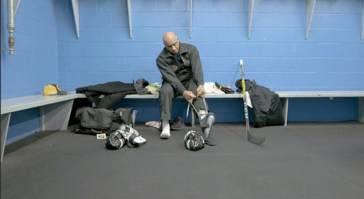 Person putting on hockey skates