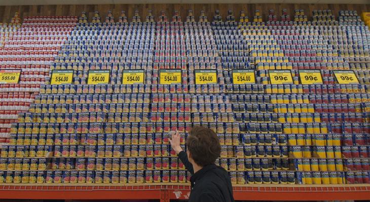 Person reaching for canned food