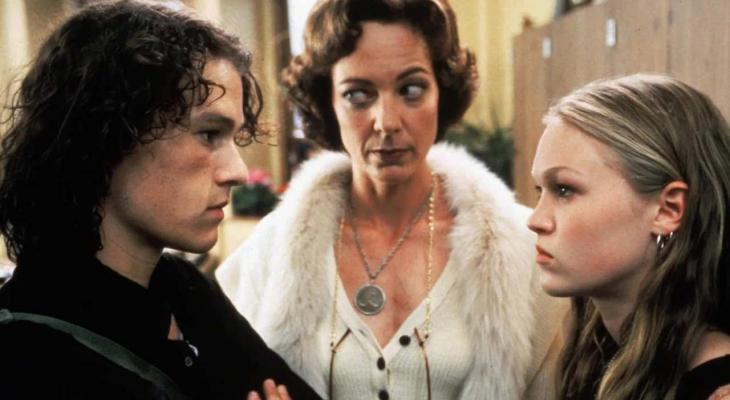 a teenage boy and girl glaring at each other with a woman in between them