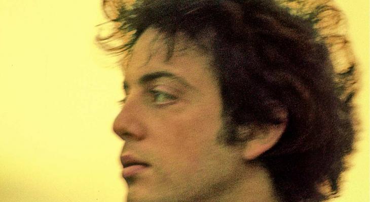 Billy Joel looking to the left