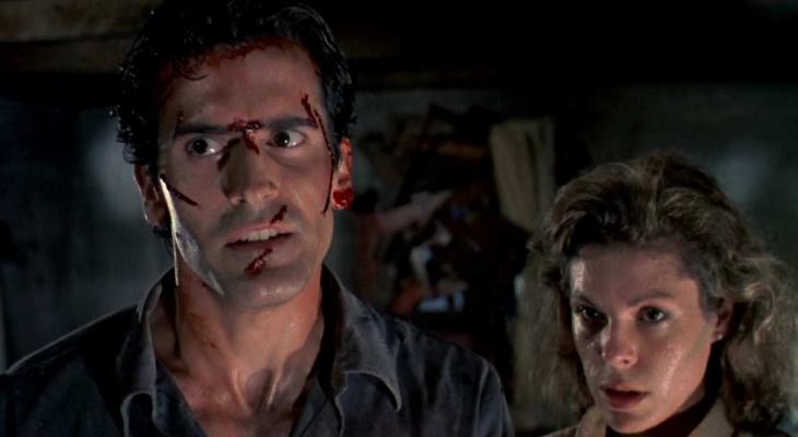 Bruce Campbell with cuts on his face standing next to a woman