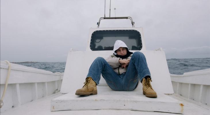 person sitting on a boat