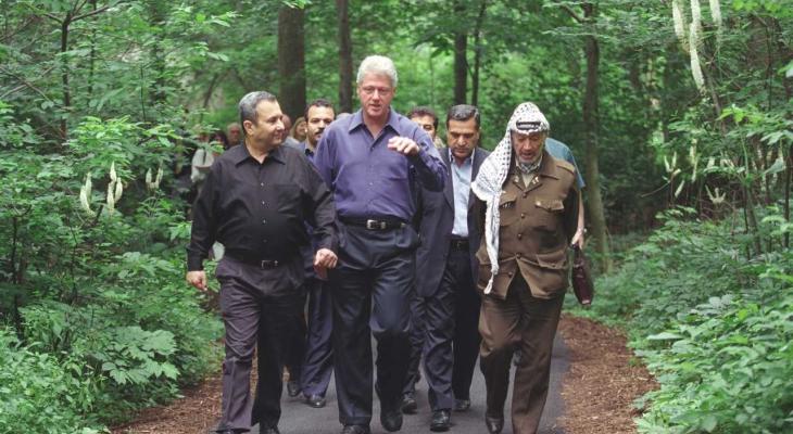 a group of people walking along a trail