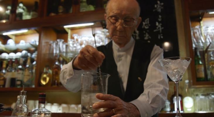 a person mixing a drink