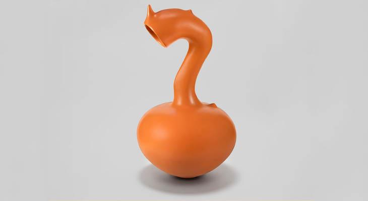 An orange ceramic vessel with a round belly and curved neck