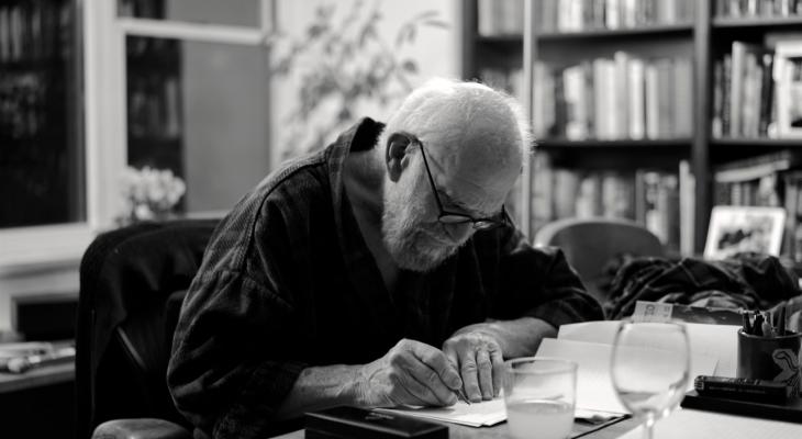 Person writing at a desk