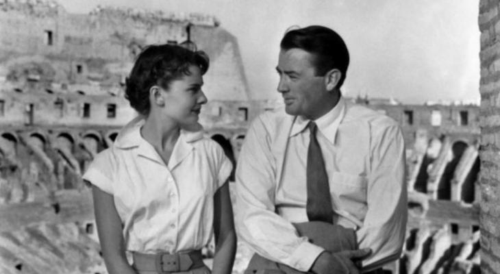 Audrey Hepburn and Gregory Peck sitting together
