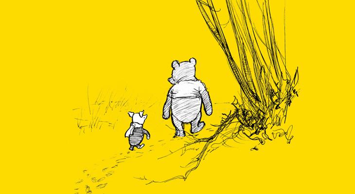 Winnie and Piglet walking on a trail