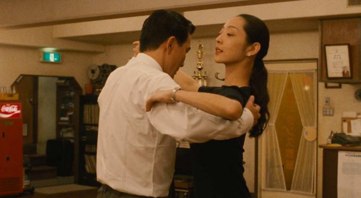 a man and woman dancing together
