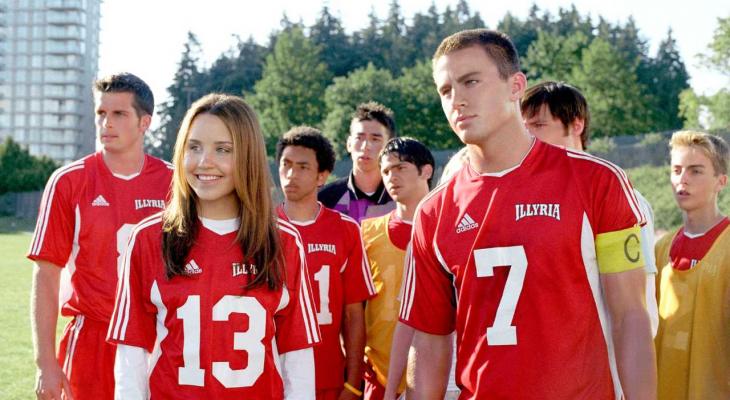 a teenage girl and boy with a soccer team