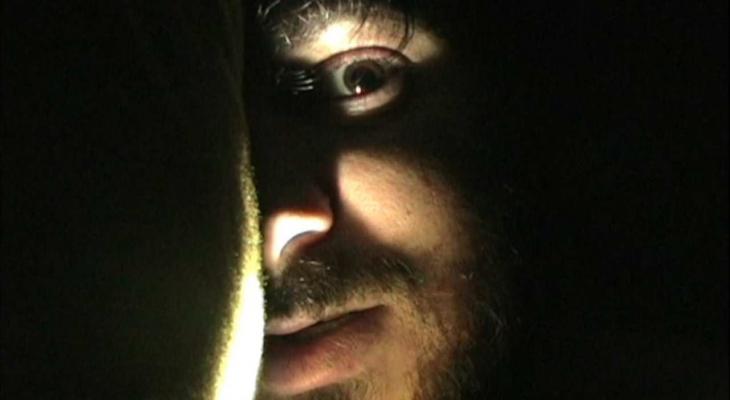 a man's face in the shadows