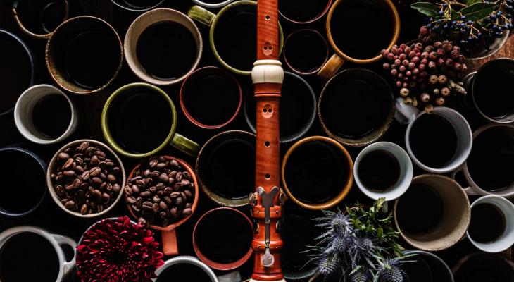 Coffee mugs with beans and an oboe on them