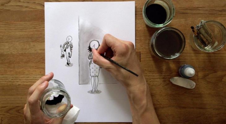 Hands drawing cartoons