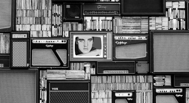 Black and white collage of vintage speakers and records. One television in the centre displays an image of Elvis Presley.