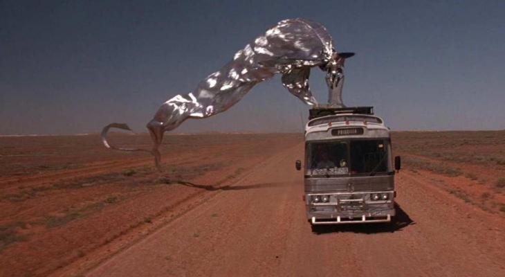 Adorned with silver streamers, Priscilla the bus makes her way through the Aussie desert.