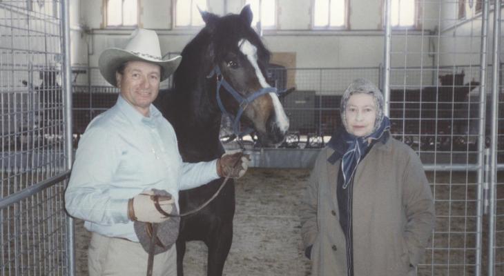 Horse trainer Monty Richards and the late Queen Elizabeth I share a moment with a horse in the stables.