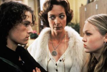 a teenage boy and girl glaring at each other with a woman in between them
