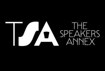 a black background with the speakers annex logo, as well as the words "THE SPEAKERS ANNEX" written in the middle of the graphic in white