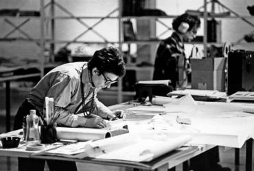 Person looking at drafting plans