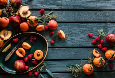 A spread of cut up stone fruits