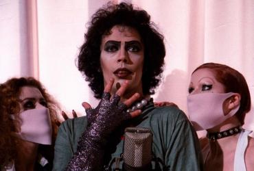 Dr. Frank-N-Furter flanked by Magenta and Columbia.