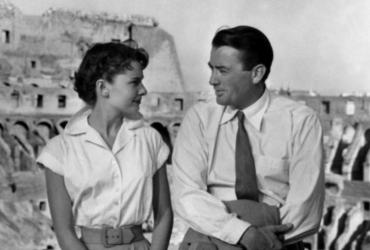 Audrey Hepburn and Gregory Peck sitting together