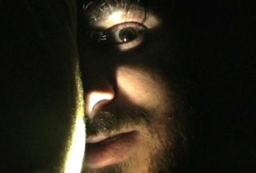 a man's face in the shadows