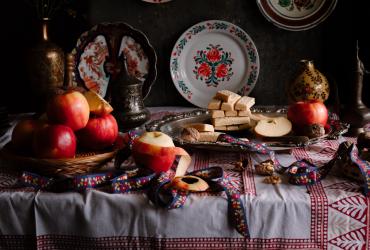 A gorgeous table spread of biscottis, apples, and fine china