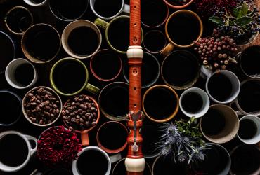 Coffee mugs with beans and an oboe on them